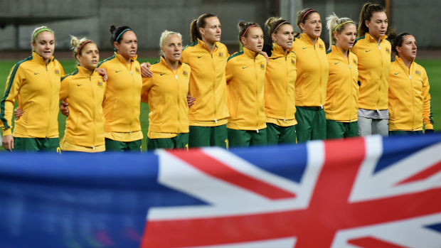 The Westfield Matildas starting XI sing the national anthem ahead of kick-off against China.