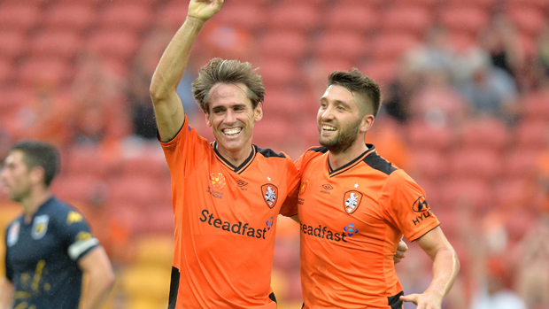 Roar midfielder Corona celebrates after putting his side 3-0 up against the Mariners.